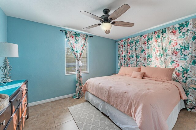 2035 29th Ave N, Saint Petersburg, FL 33713 - bedroom featuring baseboards, a ceiling fan, and light tile patterned floors