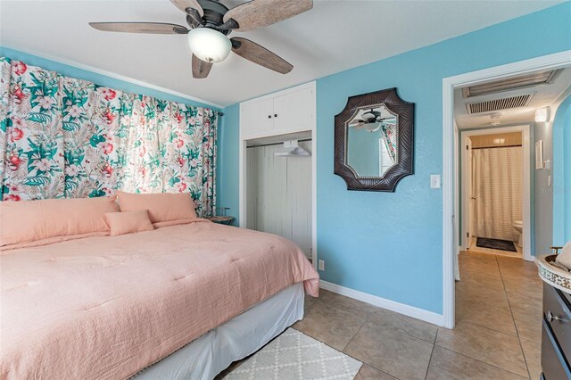 2035 29th Ave N, Saint Petersburg, FL 33713 - bedroom with light tile patterned floors, a closet, baseboards, and ceiling fan