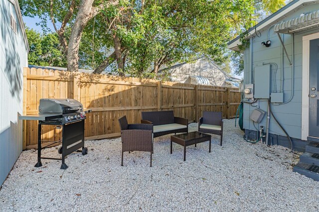 2035 29th Ave N, Saint Petersburg, FL 33713 - view of patio / terrace with a grill, a fenced backyard, and an outdoor hangout area