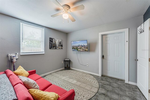 2035 29th Ave N, Saint Petersburg, FL 33713 - living area with a ceiling fan and baseboards