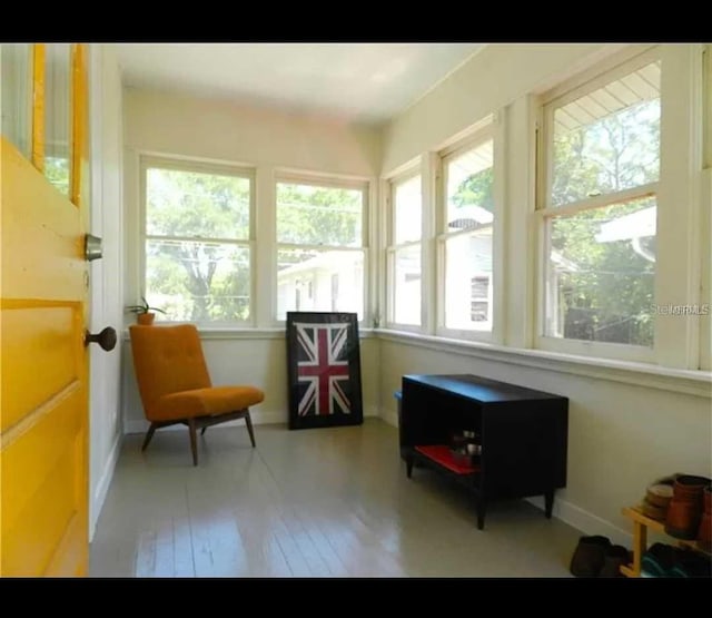 145 20th Ave SE, Saint Petersburg, FL 33705 - sunroom featuring baseboards and hardwood / wood-style flooring