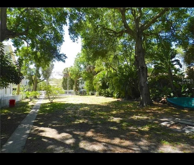 145 20th Ave SE, Saint Petersburg, FL 33705 - view of yard featuring fence