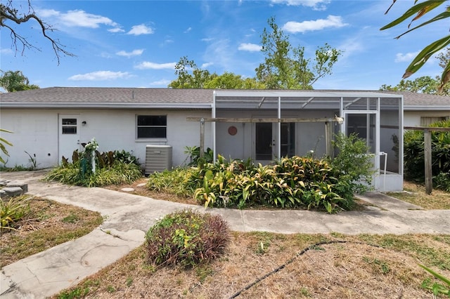 508 E Brentridge, Brandon, FL 33511 - back of house with cooling unit, roof with shingles, and glass enclosure