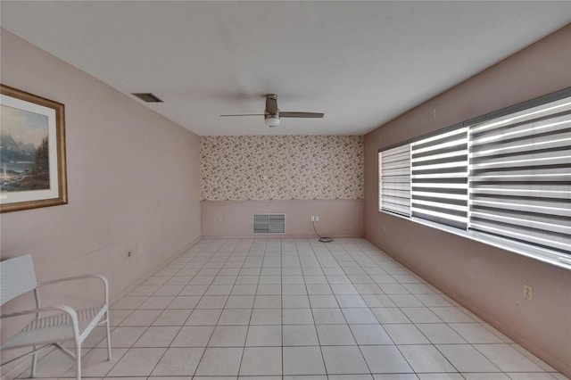 508 E Brentridge, Brandon, FL 33511 - empty room with ceiling fan, wallpapered walls, and light tile patterned floors