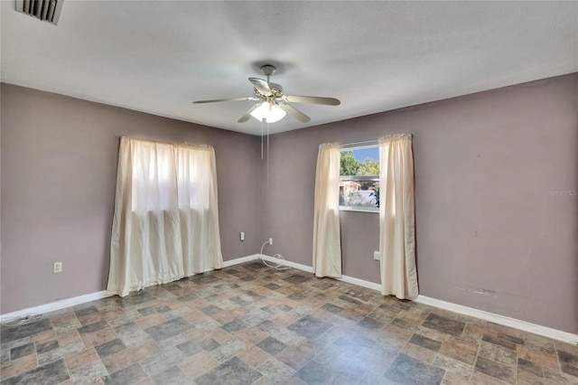 508 E Brentridge, Brandon, FL 33511 - spare room with stone finish floors, a ceiling fan, and baseboards
