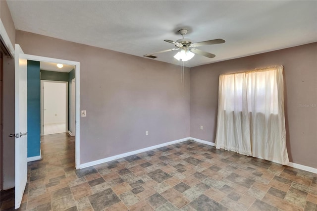 508 E Brentridge, Brandon, FL 33511 - empty room featuring stone finish flooring, ceiling fan, and baseboards