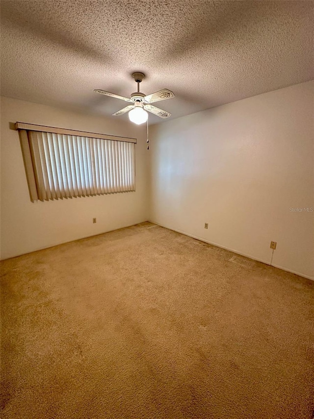 2360 Irish Ln Unit 16, Clearwater, FL 33763 - unfurnished room featuring light colored carpet, a ceiling fan, and a textured ceiling