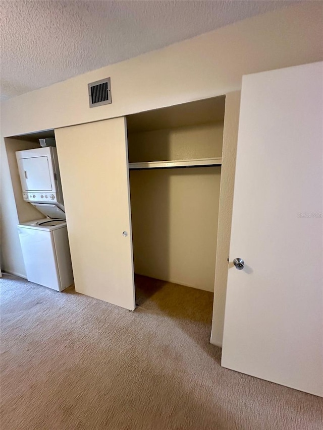 2360 Irish Ln Unit 16, Clearwater, FL 33763 - closet featuring stacked washer and clothes dryer