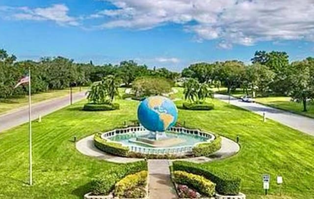 2360 Irish Ln Unit 16, Clearwater, FL 33763 - view of home's community with a lawn and view of wooded area