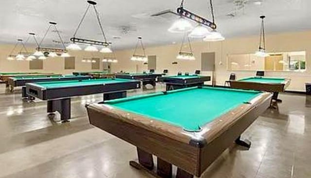 2360 Irish Ln Unit 16, Clearwater, FL 33763 - playroom with pool table and finished concrete flooring