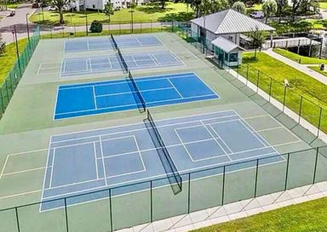 2360 Irish Ln Unit 16, Clearwater, FL 33763 - view of tennis court featuring fence