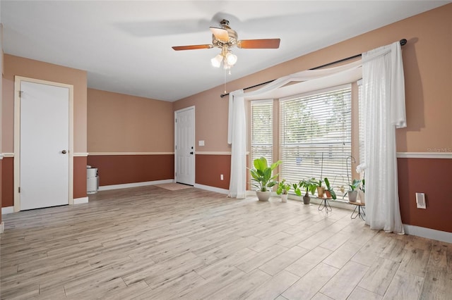 3413 W Kirby St, Tampa, FL 33614 - spare room with a ceiling fan, light wood-style flooring, and baseboards