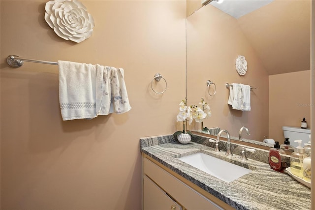 3413 W Kirby St, Tampa, FL 33614 - half bathroom featuring vanity, lofted ceiling, and toilet
