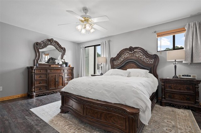 3413 W Kirby St, Tampa, FL 33614 - bedroom featuring wood finished floors, multiple windows, baseboards, and ceiling fan