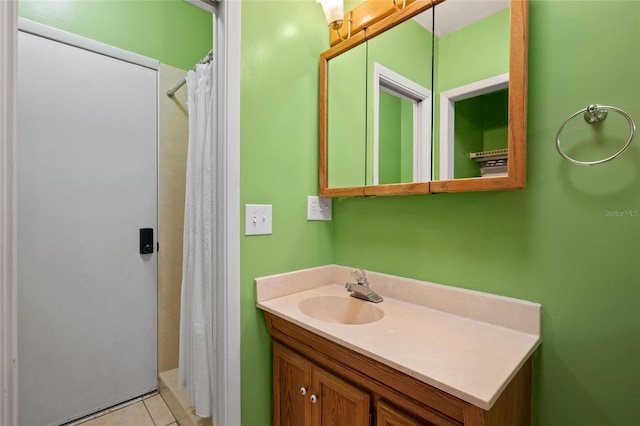 3413 W Kirby St, Tampa, FL 33614 - bathroom featuring vanity, tile patterned flooring, and a shower with shower curtain