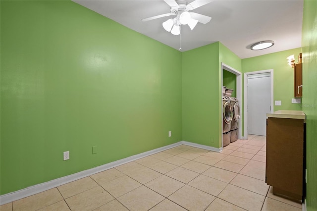 3413 W Kirby St, Tampa, FL 33614 - unfurnished room with independent washer and dryer, light tile patterned floors, ceiling fan, and baseboards