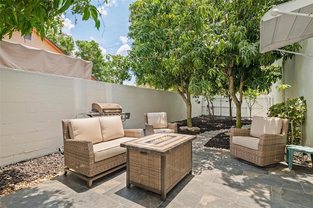 3413 W Kirby St, Tampa, FL 33614 - view of patio / terrace with a fenced backyard and an outdoor living space with a fire pit