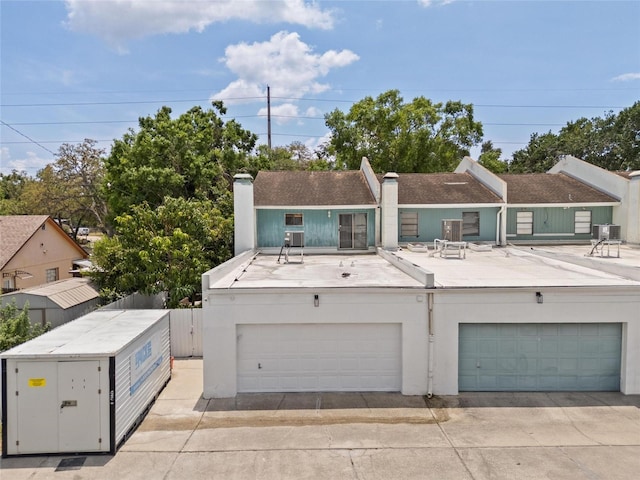 3413 W Kirby St, Tampa, FL 33614 - multi unit property with a chimney, a garage, and stucco siding