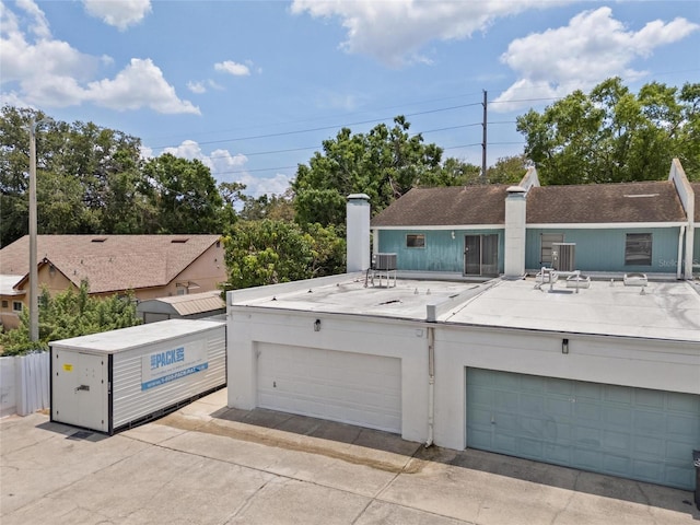 3413 W Kirby St, Tampa, FL 33614 - view of front facade with a chimney and a garage