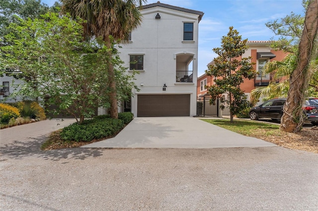 412 S Albany Ave Unit 2, Tampa, FL 33606 - view of front of home featuring stucco siding, a garage, and concrete driveway