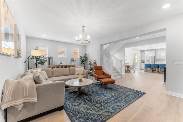 412 S Albany Ave Unit 2, Tampa, FL 33606 - living area with stairway, a chandelier, light wood-style flooring, recessed lighting, and baseboards