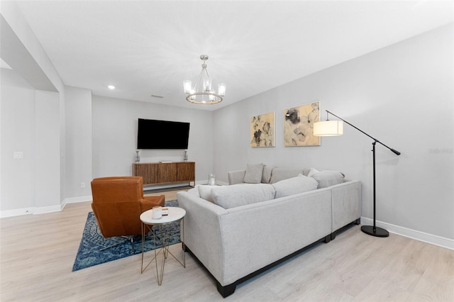 412 S Albany Ave Unit 2, Tampa, FL 33606 - living area with light wood finished floors, baseboards, a chandelier, and recessed lighting