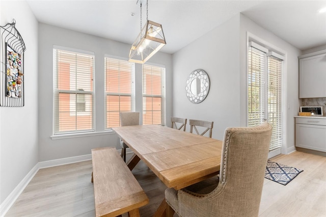 412 S Albany Ave Unit 2, Tampa, FL 33606 - dining space featuring light wood finished floors and baseboards