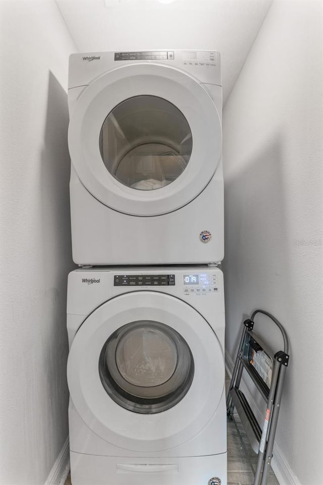 412 S Albany Ave Unit 2, Tampa, FL 33606 - laundry area featuring stacked washer / dryer and baseboards