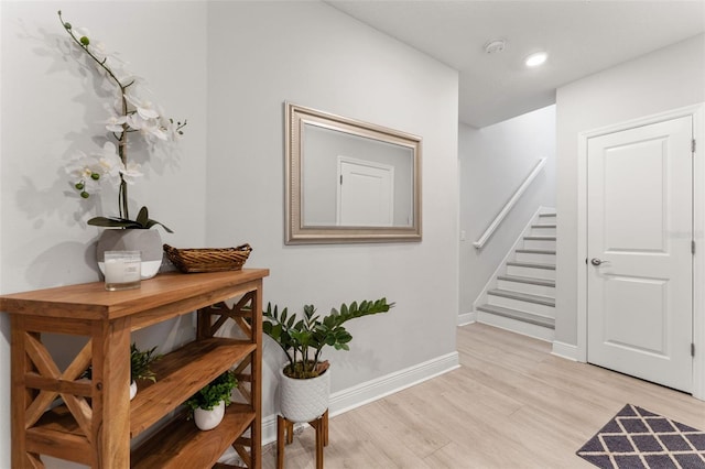 412 S Albany Ave Unit 2, Tampa, FL 33606 - hallway with light wood-style flooring, stairs, baseboards, and recessed lighting