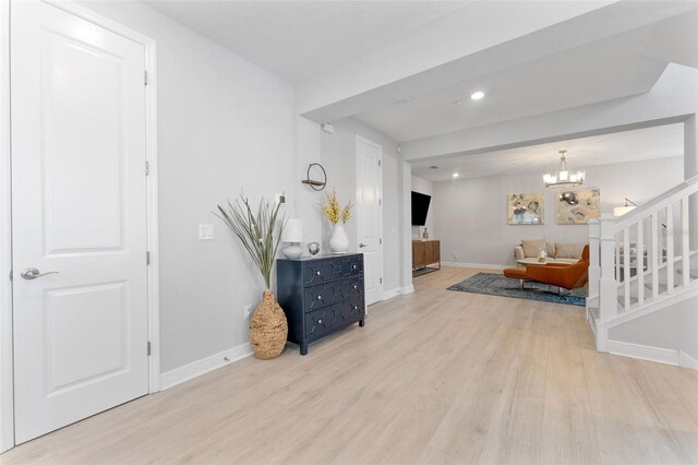 412 S Albany Ave Unit 2, Tampa, FL 33606 - living area with wood finished floors, baseboards, recessed lighting, and a chandelier