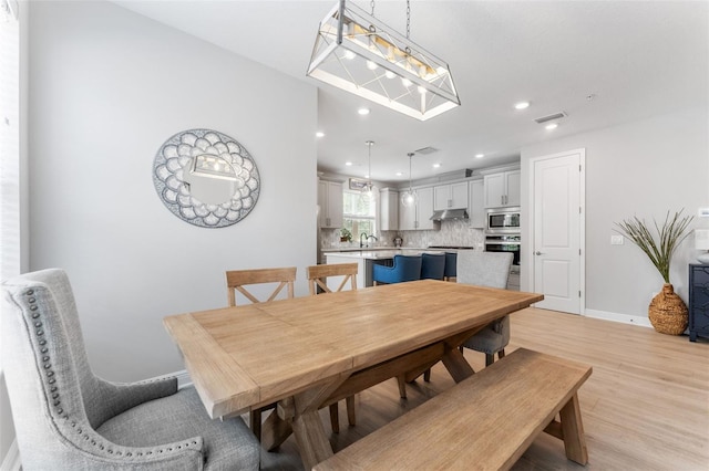 412 S Albany Ave Unit 2, Tampa, FL 33606 - dining area featuring light wood-style floors, recessed lighting, and baseboards
