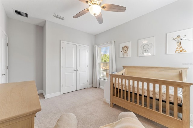 412 S Albany Ave Unit 2, Tampa, FL 33606 - bedroom featuring baseboards, light carpet, a closet, and ceiling fan
