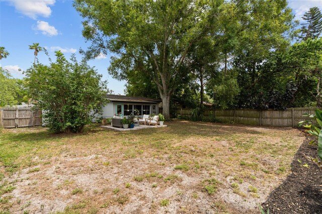 view of yard with an outdoor hangout area and a patio