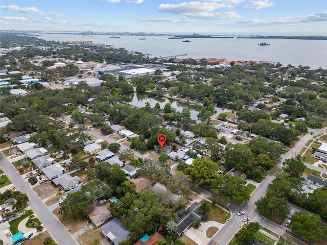 aerial view of property's location with a nearby body of water
