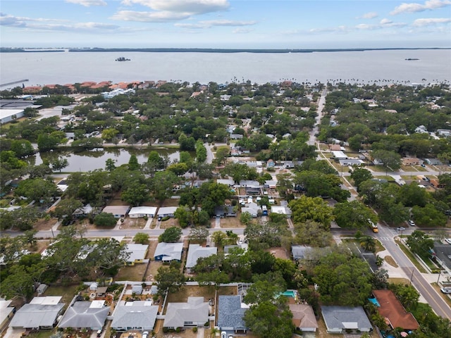 aerial view of residential area featuring a large body of water