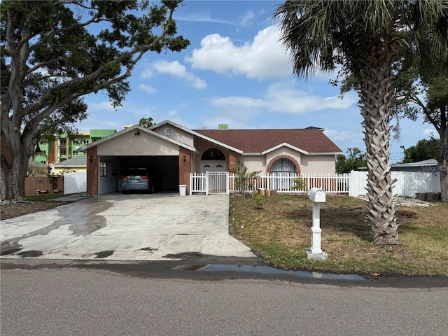 2026 Aaron Pl, Clearwater, FL 33760 - view of front of property with driveway, stucco siding, and a garage