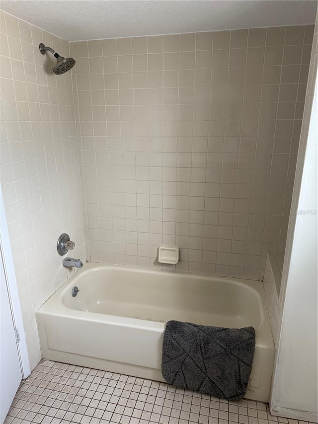 2026 Aaron Pl, Clearwater, FL 33760 - full bath featuring tile patterned flooring and  shower combination