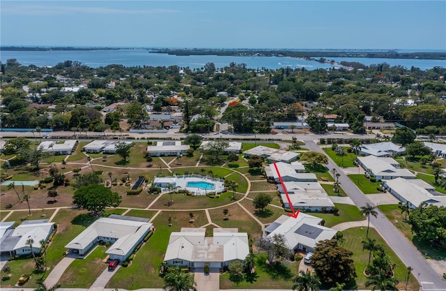 aerial view of residential area featuring a nearby body of water
