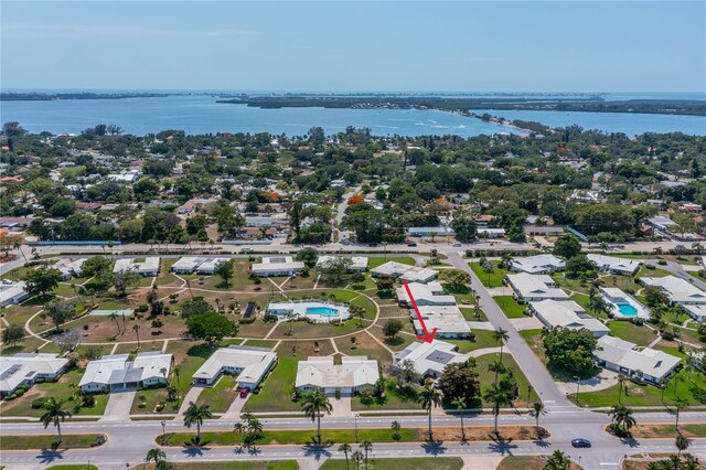 aerial perspective of suburban area featuring a large body of water