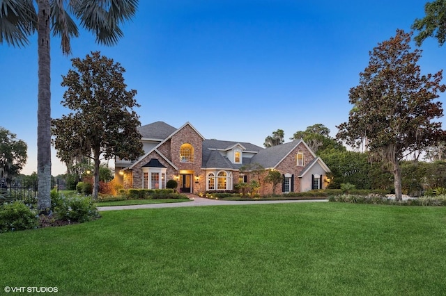 919 Ballinger Rd, Lutz, FL 33548 - view of front of property with stone siding and a front yard