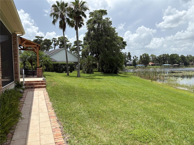 919 Ballinger Rd, Lutz, FL 33548 - view of green lawn with a water view and a patio