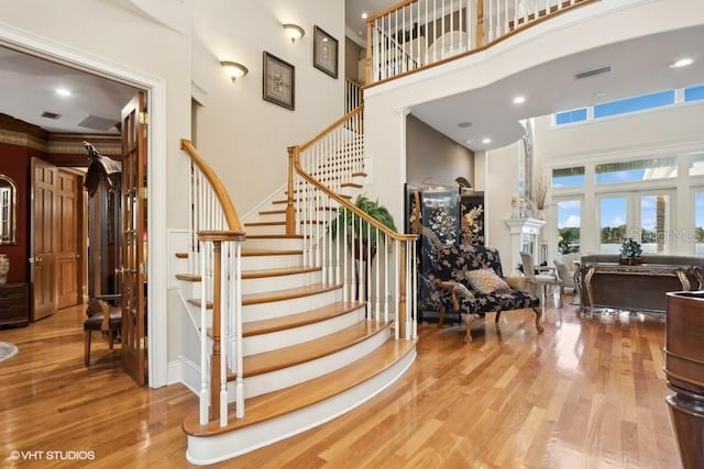 919 Ballinger Rd, Lutz, FL 33548 - stairway featuring a high ceiling and wood finished floors