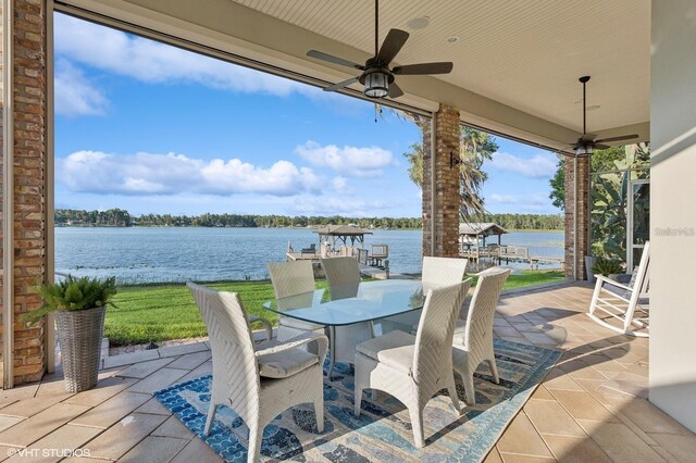 919 Ballinger Rd, Lutz, FL 33548 - view of patio / terrace with ceiling fan, a water view, and outdoor dining space