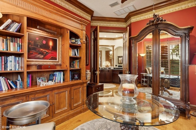 919 Ballinger Rd, Lutz, FL 33548 - living area featuring crown molding and light wood-style flooring