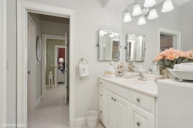 919 Ballinger Rd, Lutz, FL 33548 - bathroom featuring a chandelier, vanity, and tile patterned flooring