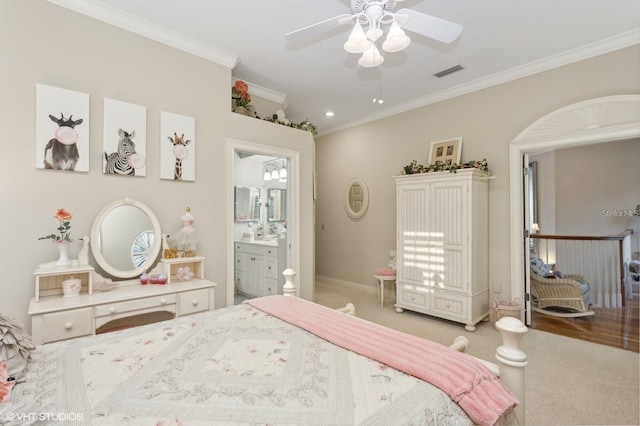 919 Ballinger Rd, Lutz, FL 33548 - carpeted bedroom with crown molding and ensuite bath