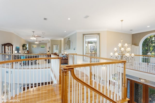 919 Ballinger Rd, Lutz, FL 33548 - hallway with an upstairs landing, a chandelier, ornamental molding, and recessed lighting