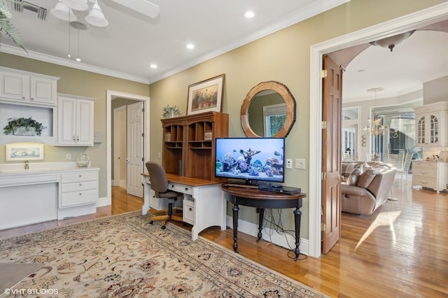 919 Ballinger Rd, Lutz, FL 33548 - office area featuring ceiling fan, built in desk, light wood-type flooring, recessed lighting, and ornamental molding