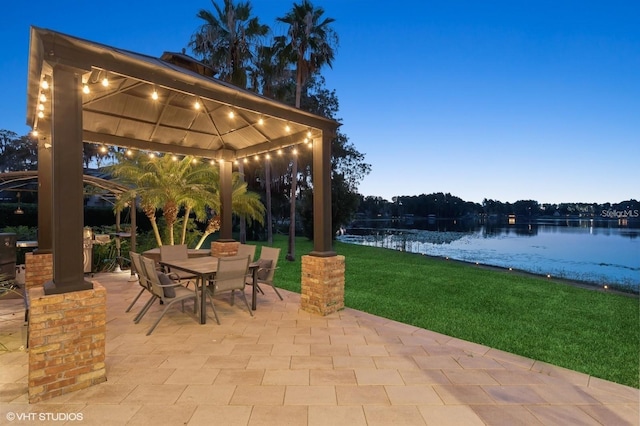 919 Ballinger Rd, Lutz, FL 33548 - view of patio featuring a gazebo, outdoor dining area, and a water view