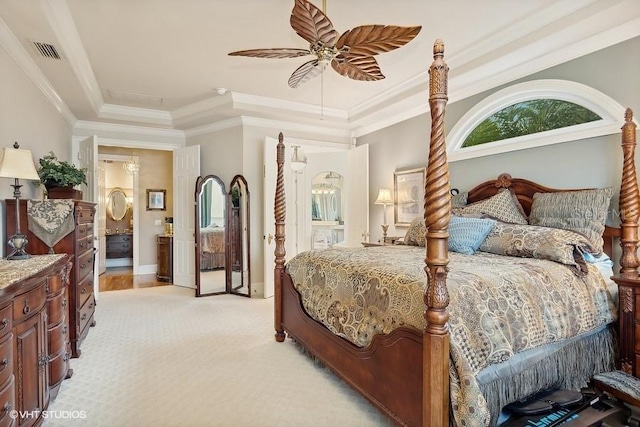 919 Ballinger Rd, Lutz, FL 33548 - bedroom featuring a raised ceiling, light colored carpet, crown molding, a ceiling fan, and connected bathroom